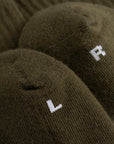 Cuera 2-pack Cuera Padel Socks in Army/White, neck label and care tag detail