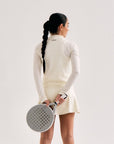 Model wearing Cuera Active Cuera Zip Cardigan in Off White, back studio view
