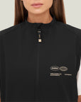 Model wearing Cuera Active Gilet in Black, close-up detail on model
