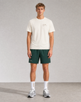 Model wearing Cuera Oncourt Shorts & T-shirt in Court Green & Off White, front studio view