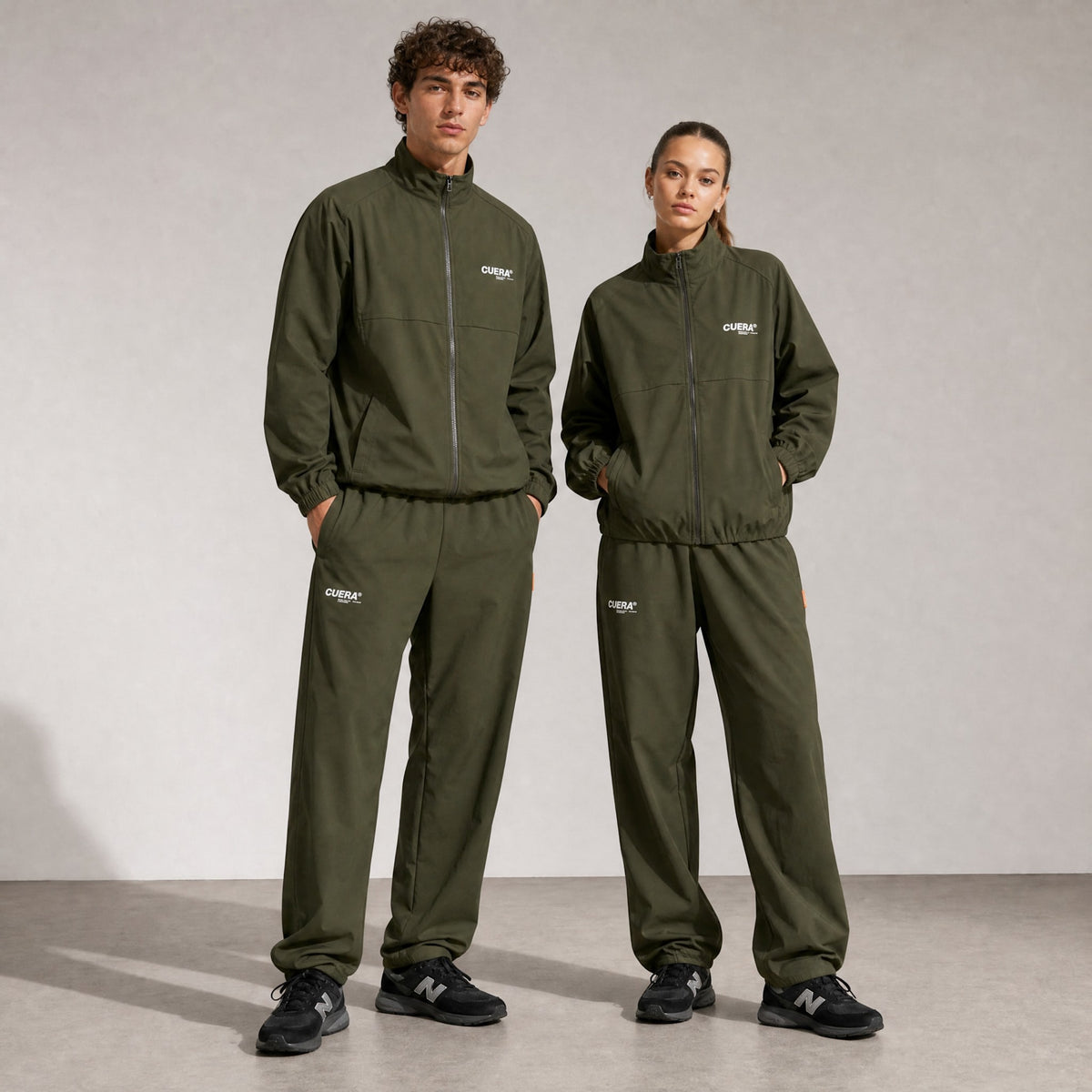 Model wearing Cuera Active Cuera Track Jacket in Army, front studio view