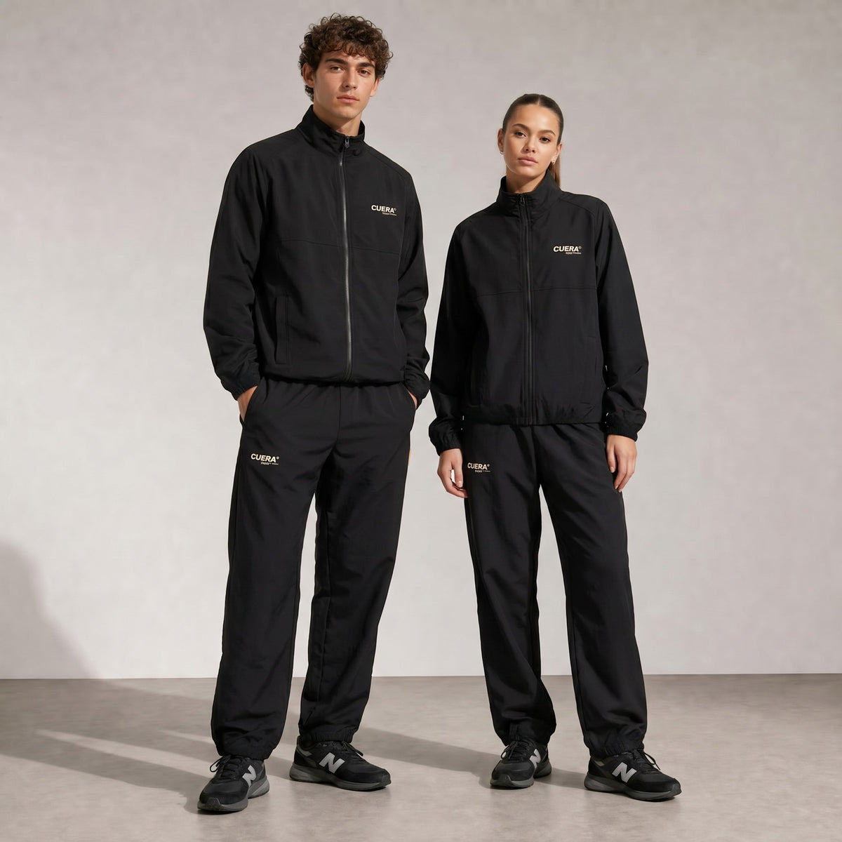 Model wearing Cuera Active Cuera Track Jacket in Black, front studio view