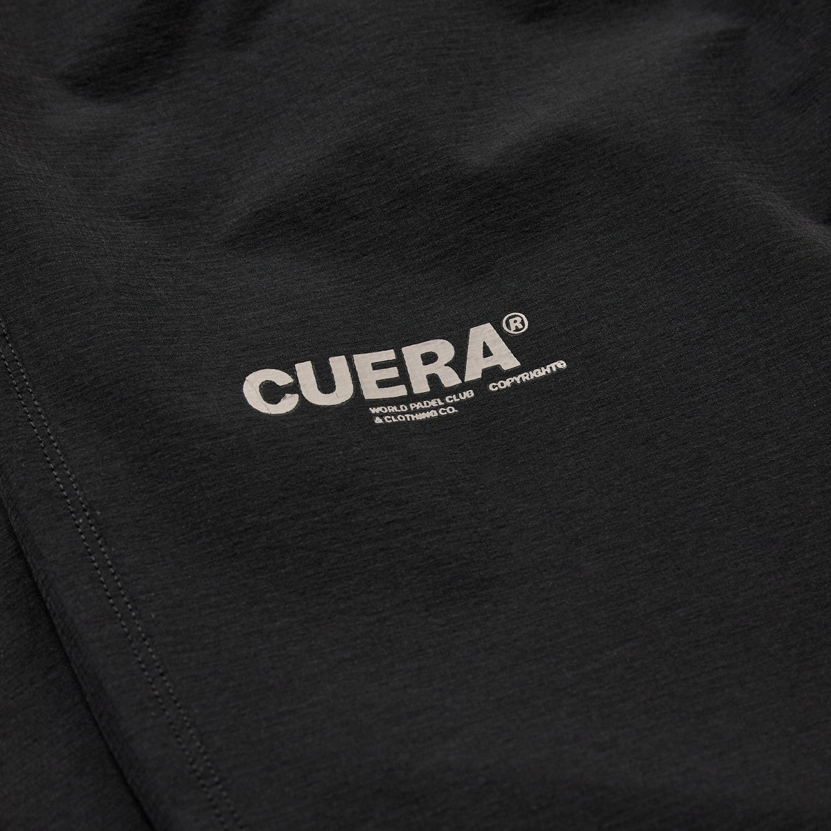 Cuera Active Cuera Track Pants in Black, logo print detail