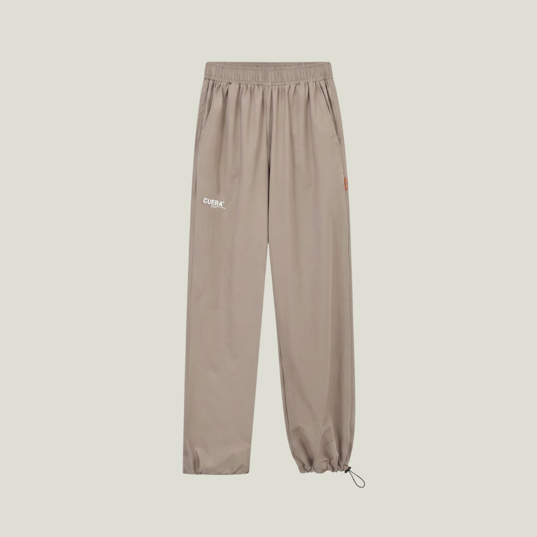 Cuera Active Cuera Track Pants in Taupe, flat lay front view