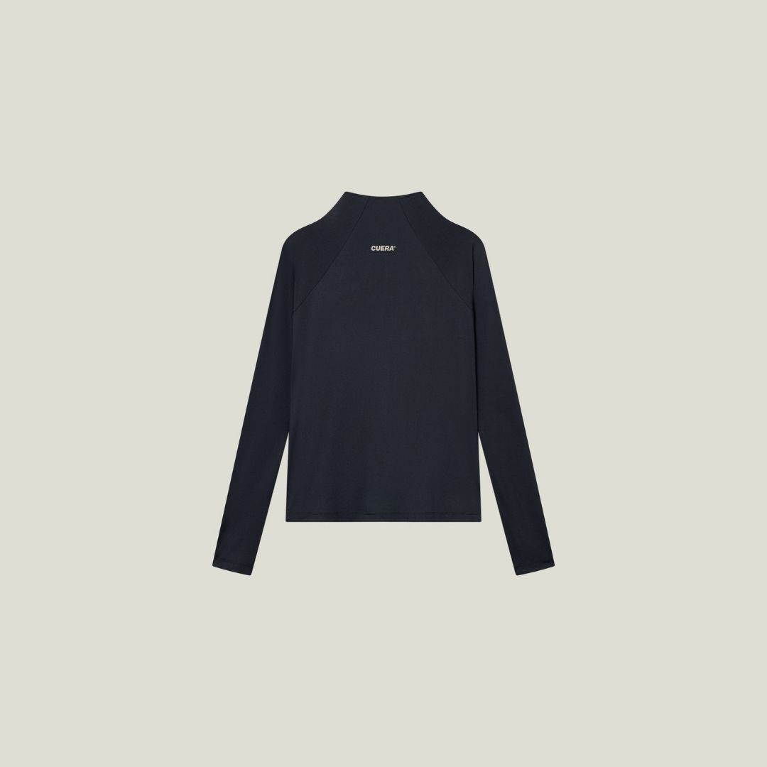 Model wearing Cuera Active Cuera Zip Cardigan in Black, front studio view