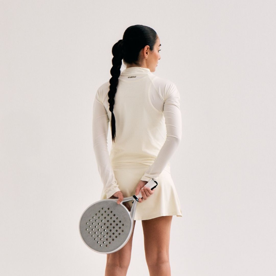 Model wearing Cuera Active Cuera Zip Cardigan in Off White, back studio view