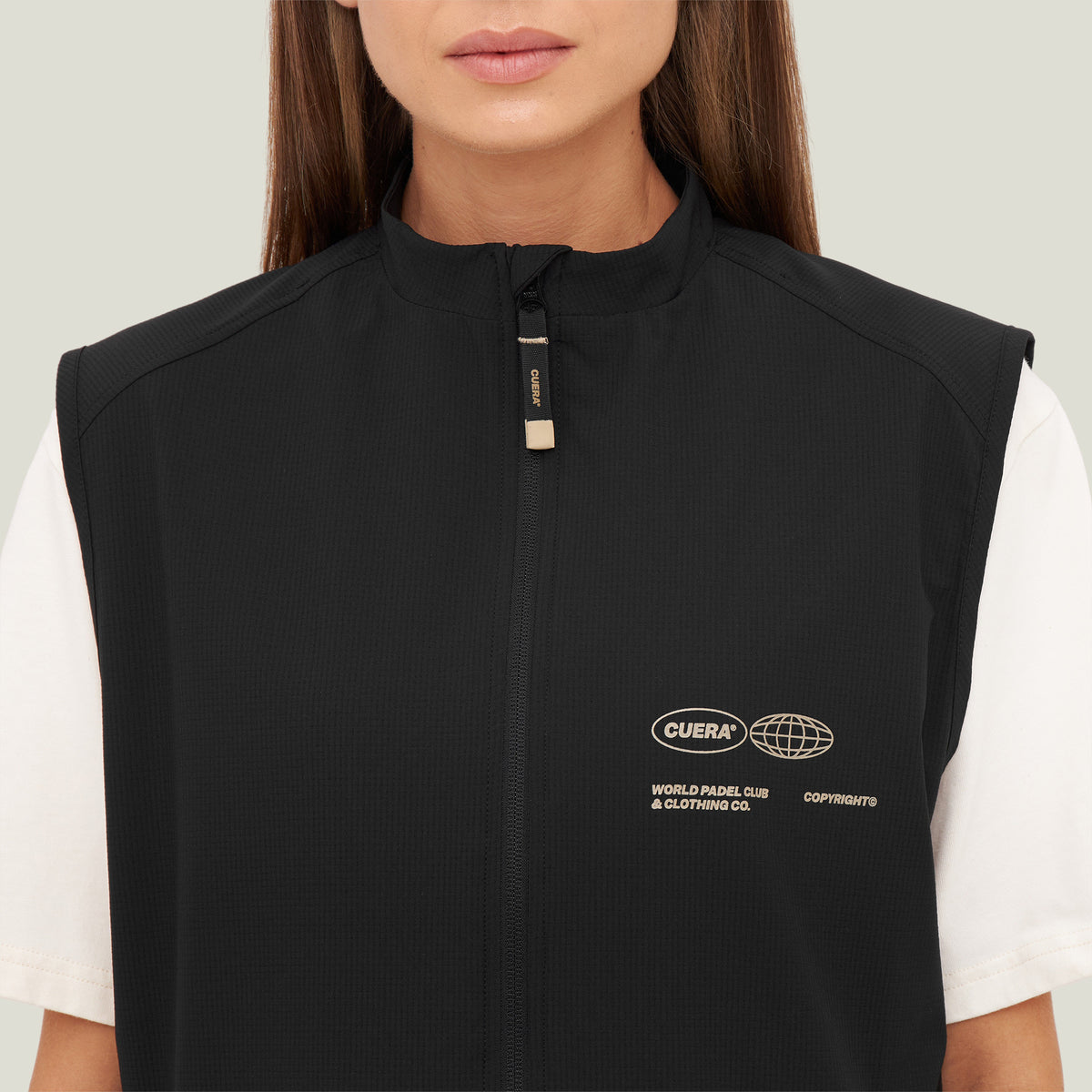 Model wearing Cuera Active Gilet in Black, close-up detail on model
