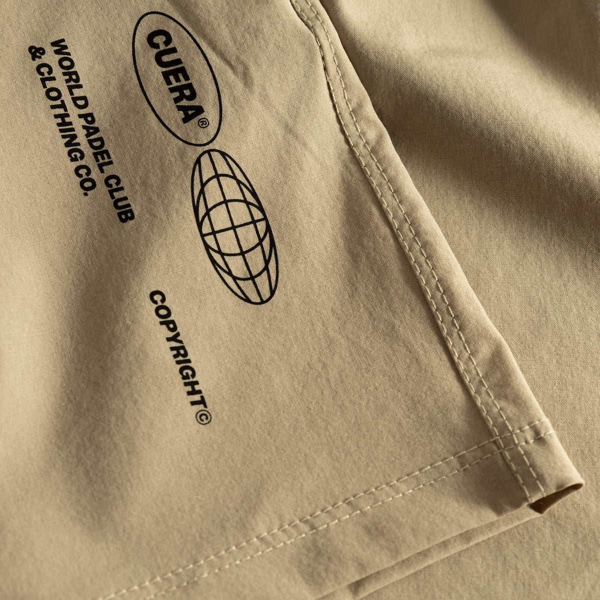 Cuera Womens Active Globe Shorts in Sand, logo print detail