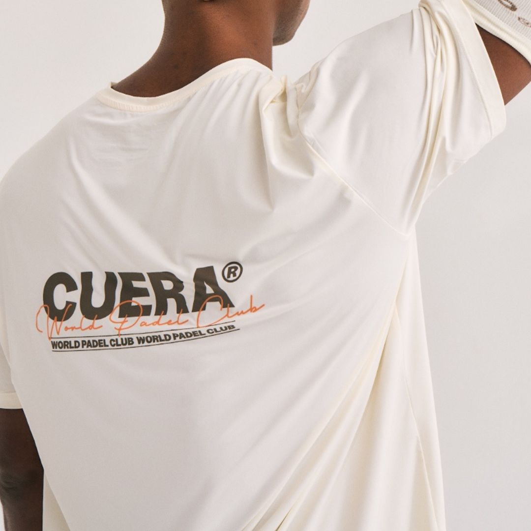 Model wearing Cuera Active Light Weight T-Shirt in Off White/Walnut, close-up detail on model