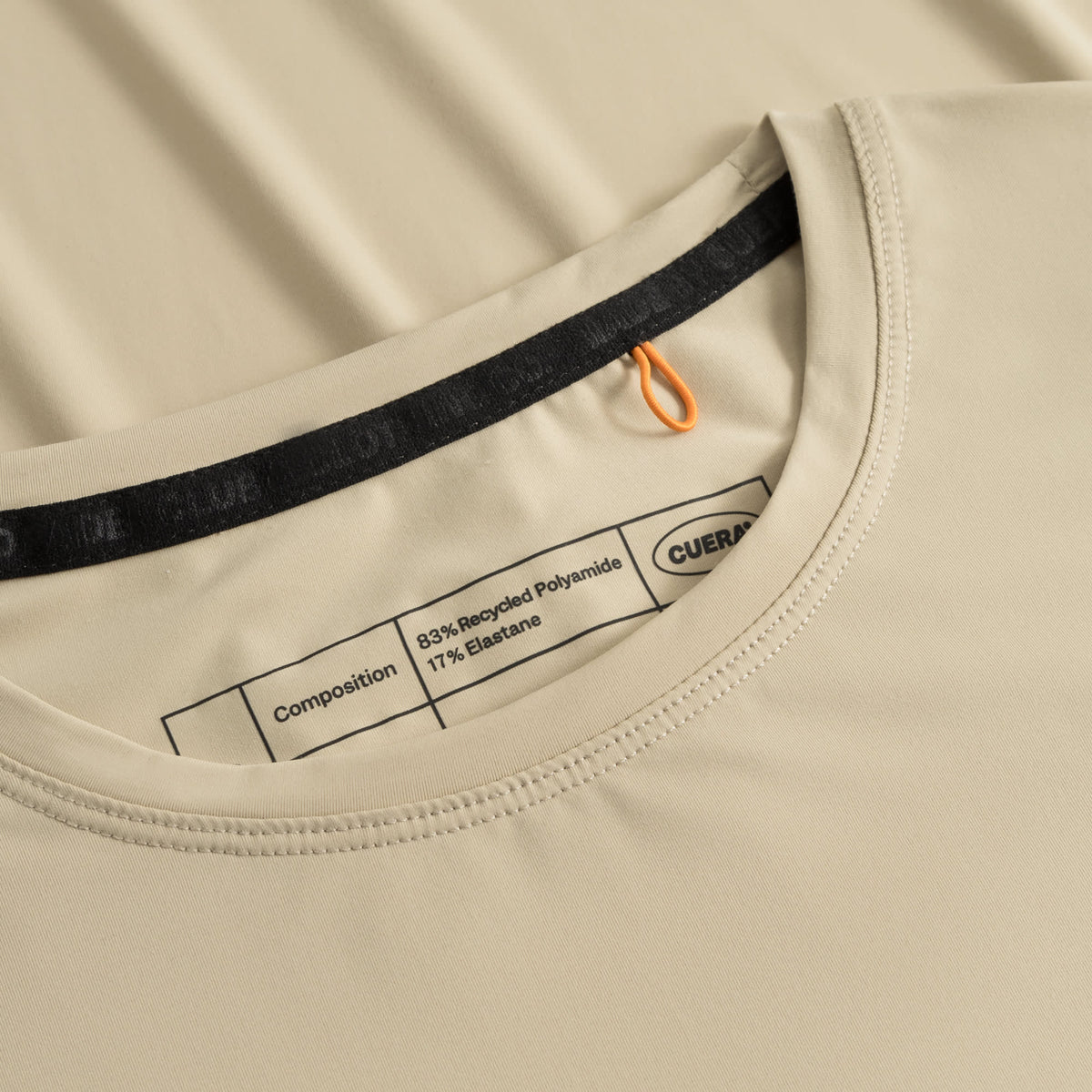 Cuera Active Light Weight T-Shirt in Sand, neck label and care tag detail