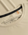 Cuera Active Light Weight T-Shirt in Sand, neck label and care tag detail