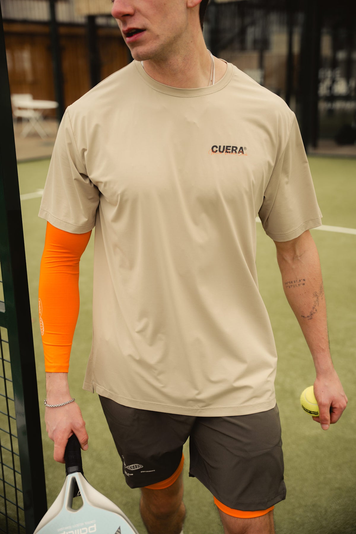 Model wearing Cuera Active Light Weight T-Shirt in Sand, front studio view