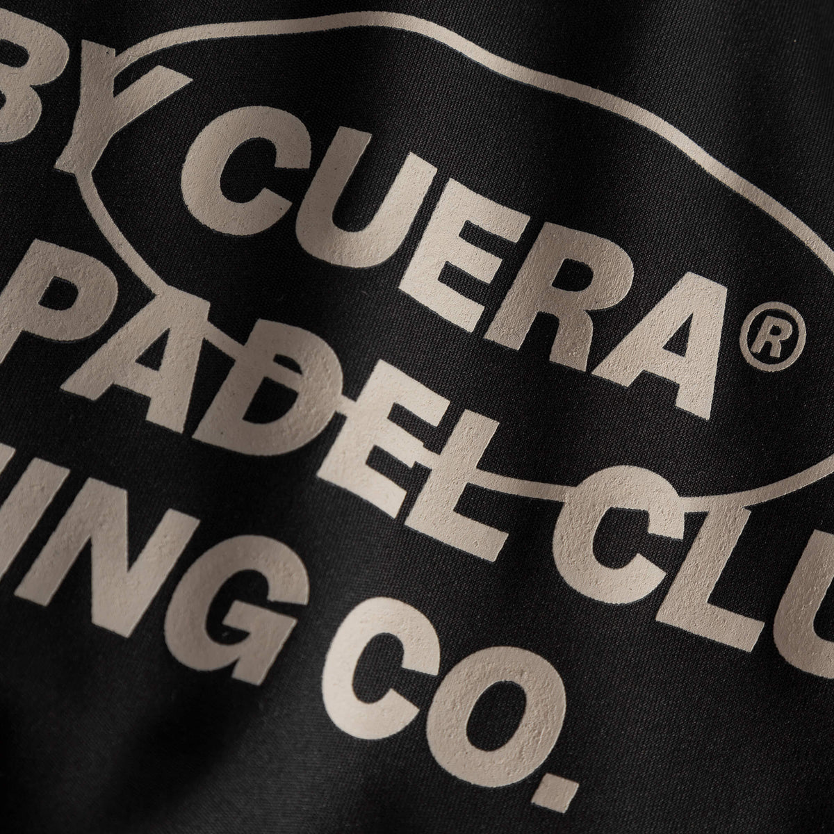 Made By Cuera logo print detail on the Active Made Bra in Black