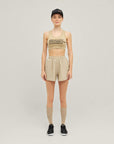 Woman wearing Cuera Active Made Bra in Grey with matching shorts, front studio view