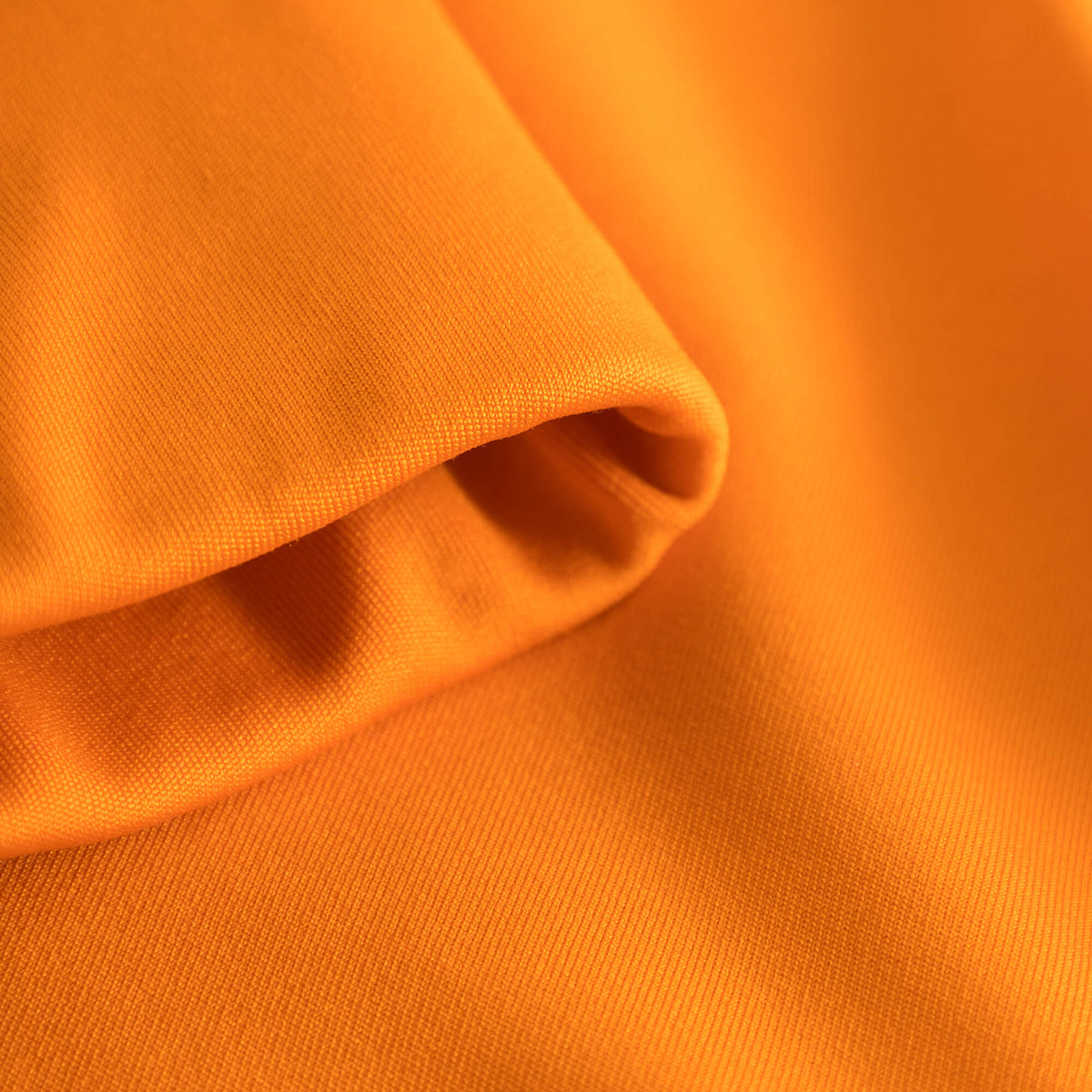 Fabric fold detail of Cuera Active Made Bra in Orange