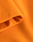 Fabric fold detail of Cuera Active Made Bra in Orange