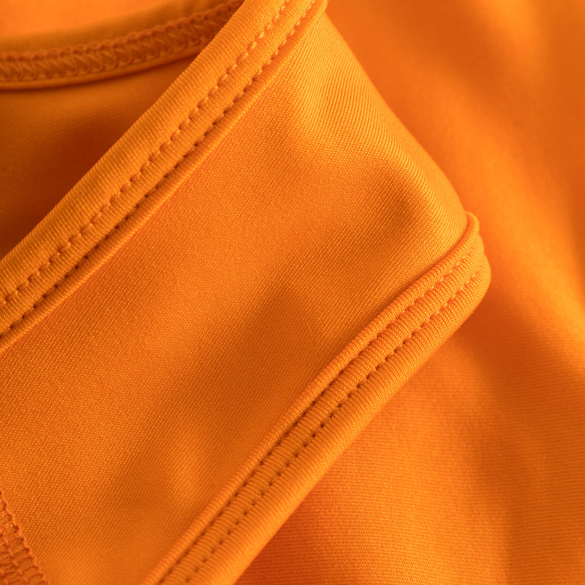 Strap and binding detail of Cuera Active Made Bra in Orange