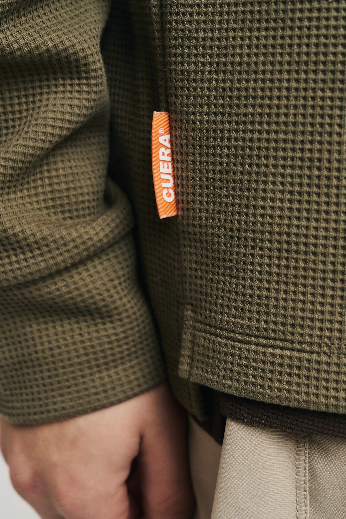 Cuera Active Structure Half Zip in Army, neck label and care tag detail