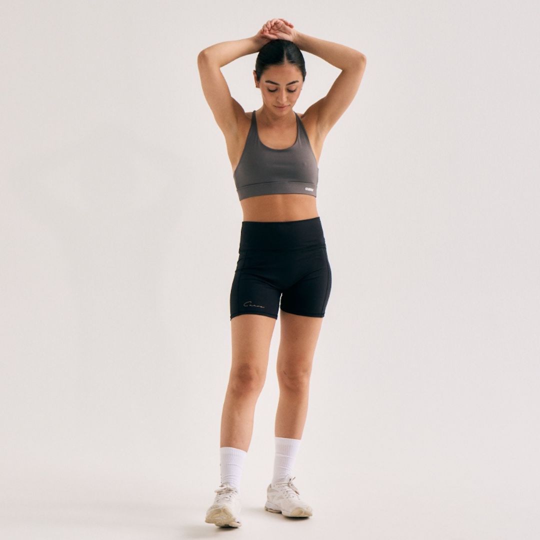 Model wearing Cuera Active Ultra Short Inner Tights in Black, front studio view