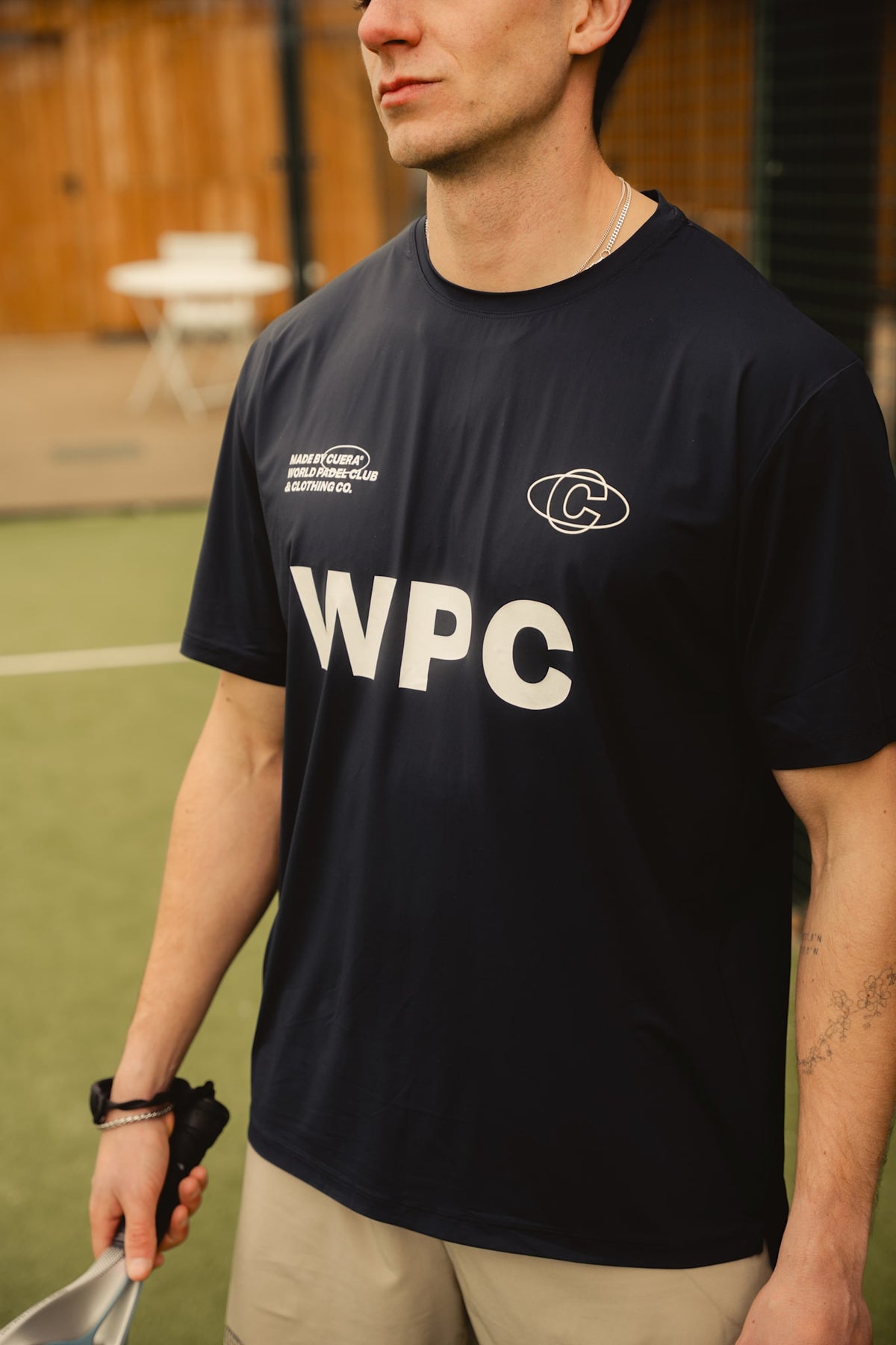 Model wearing Cuera Active WPC Light Weight T-Shirt in Navy, front studio view