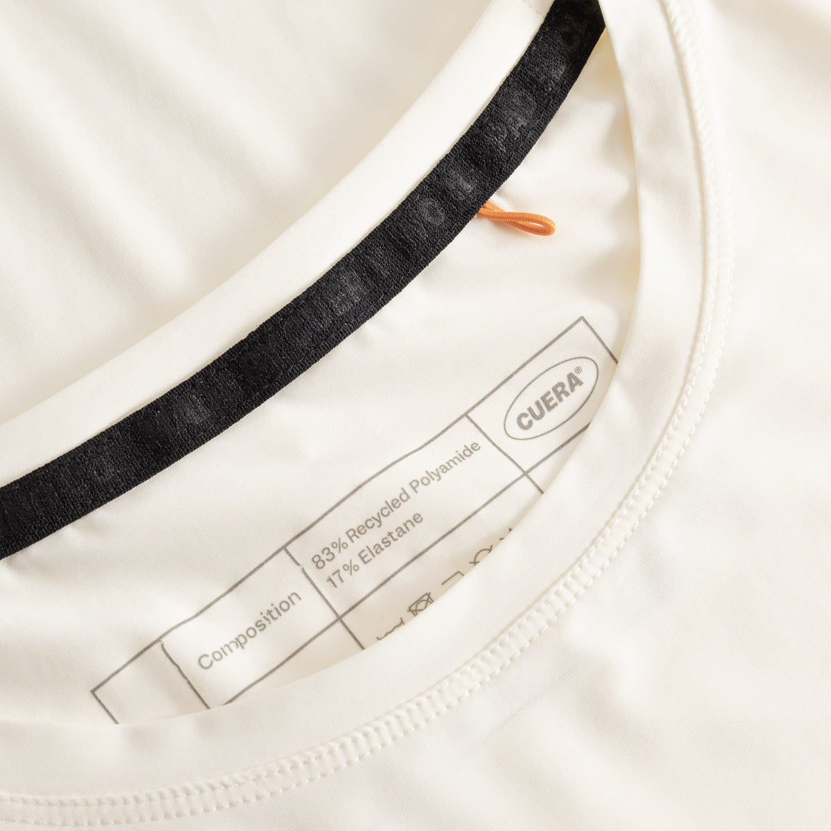 Cuera Active WPC Light Weight T-Shirt in Off White/Walnut, neck label and care tag detail