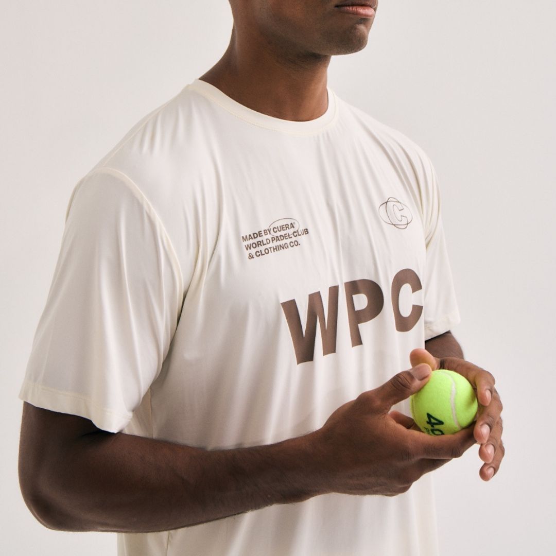 Model wearing Cuera Active WPC Light Weight T-Shirt in Off White/Walnut, close-up detail on model