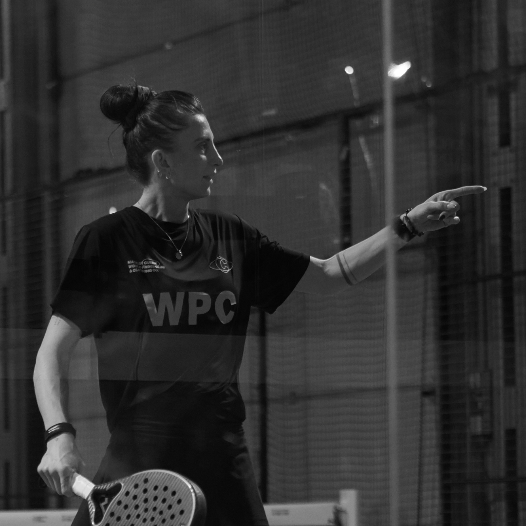 Model wearing Cuera Ambassador Mie Skov in WPC Bundle, lifestyle action shot on the padel court