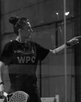 Model wearing Cuera Ambassador Mie Skov in WPC Bundle, lifestyle action shot on the padel court