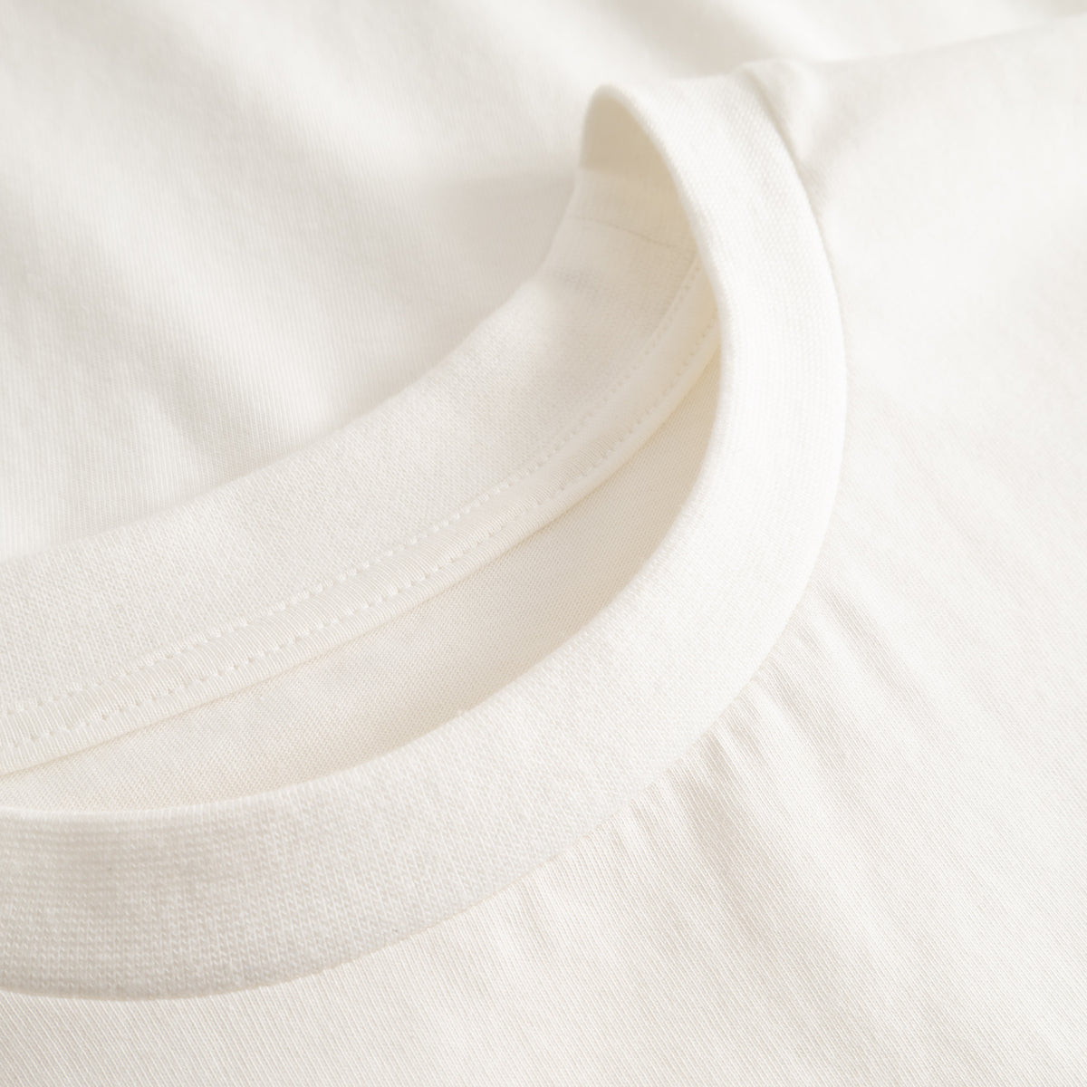 Cuera Offcourt Logo T-Shirt in Off White w. Black, neck label and care tag detail