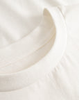 Cuera Offcourt Logo T-Shirt in Off White w. Black, neck label and care tag detail