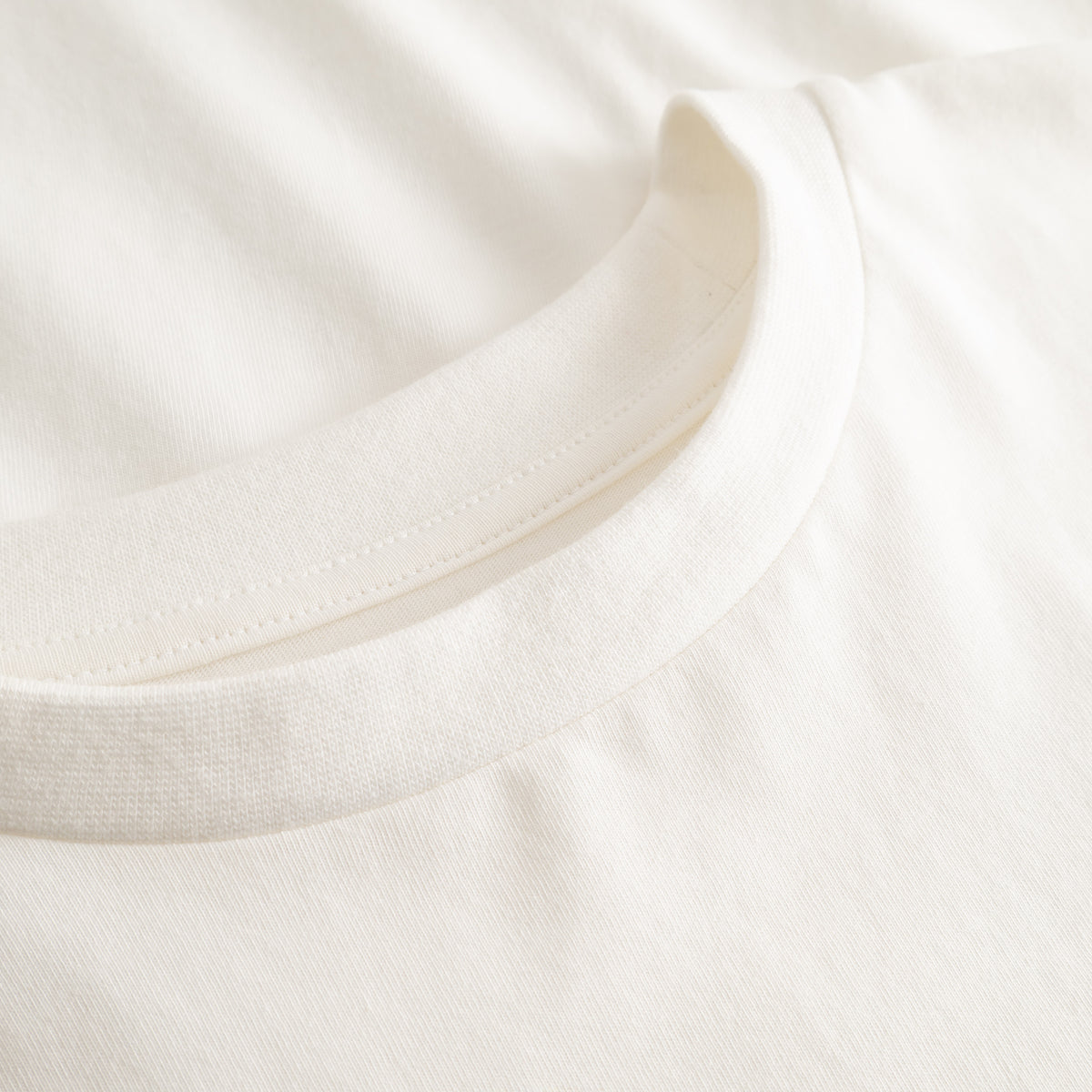 Cuera Offcourt Logo T-Shirt in Off White w. Orange, neck label and care tag detail