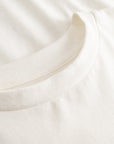 Cuera Offcourt Logo T-Shirt in Off White w. Orange, neck label and care tag detail