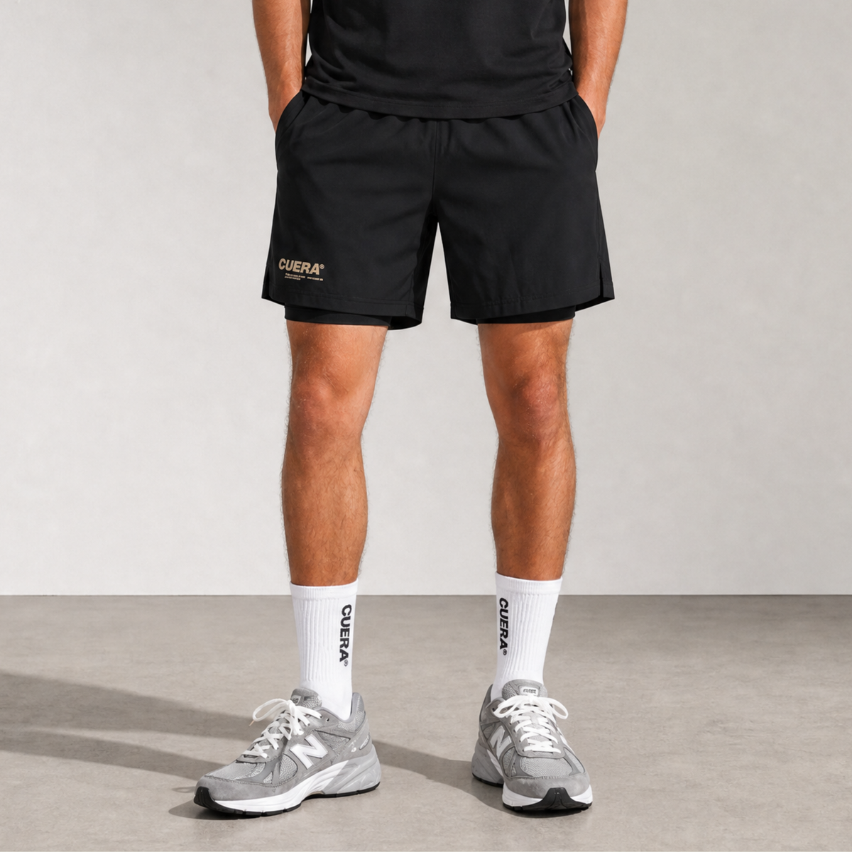 Model wearing Cuera Oncourt 2in1 Shorts & 2-pack socks, front studio view