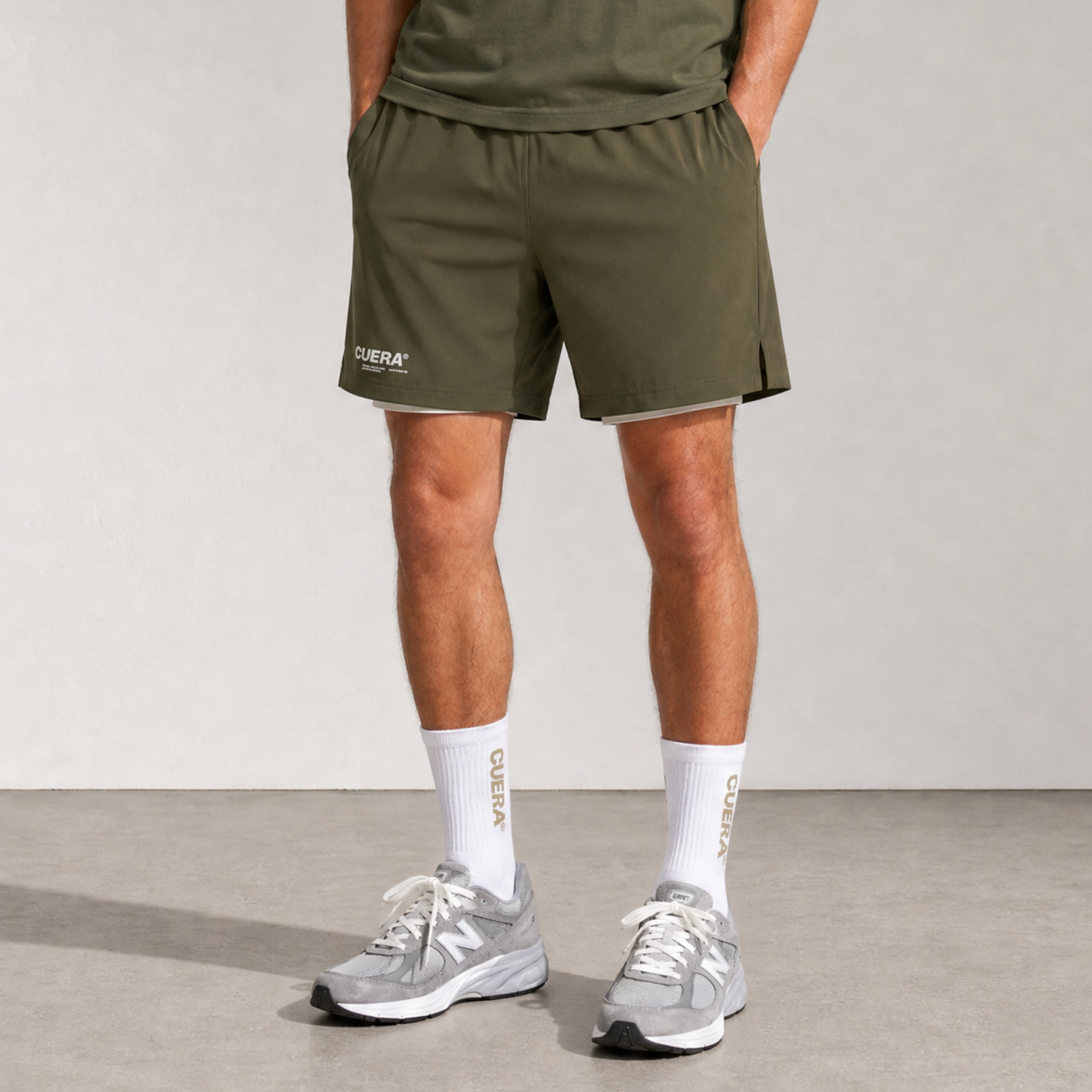 Model wearing Cuera Oncourt 2in1 Shorts Army & 2-pack socks Walnut, front studio view