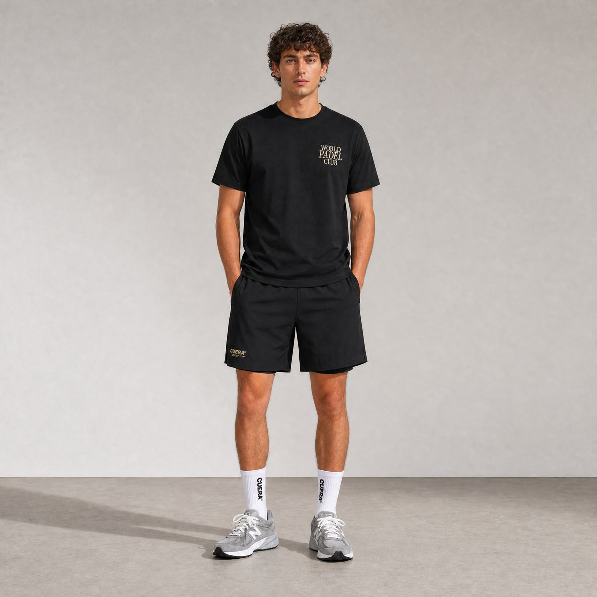 Model wearing Cuera Oncourt 2in1 Shorts in Black, front studio view