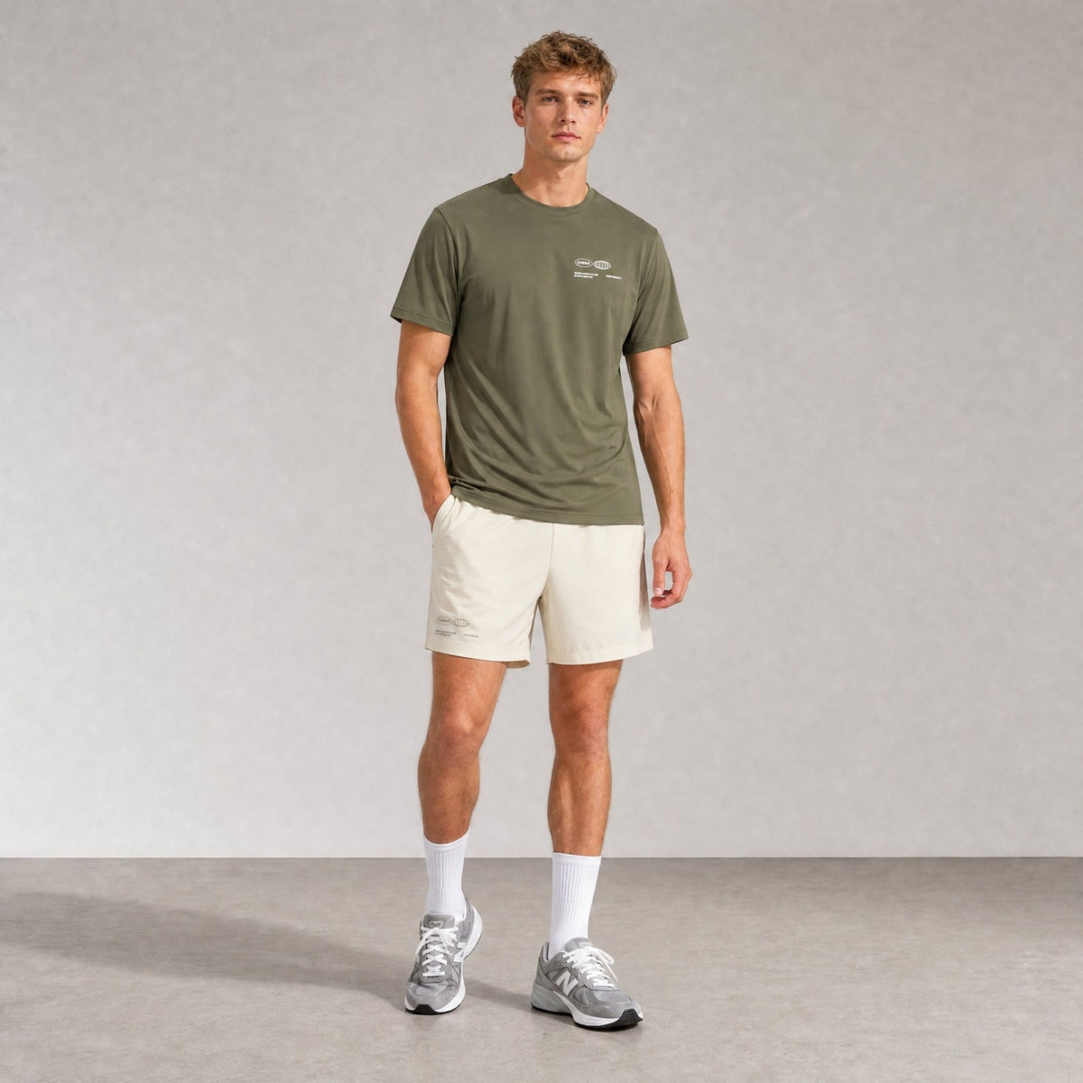 Model wearing Cuera Oncourt Army/Off White Uniform Bundle, front studio view