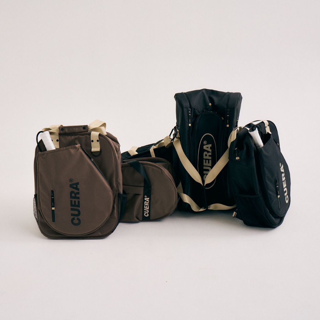 Model wearing Cuera Oncourt Bagpack small in Walnut, lifestyle action shot on the padel court
