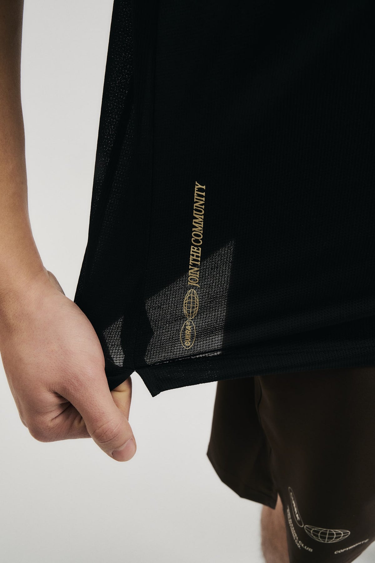 Model wearing Cuera Oncourt Breathe Cuera T-Shirt in Black, close-up detail on model