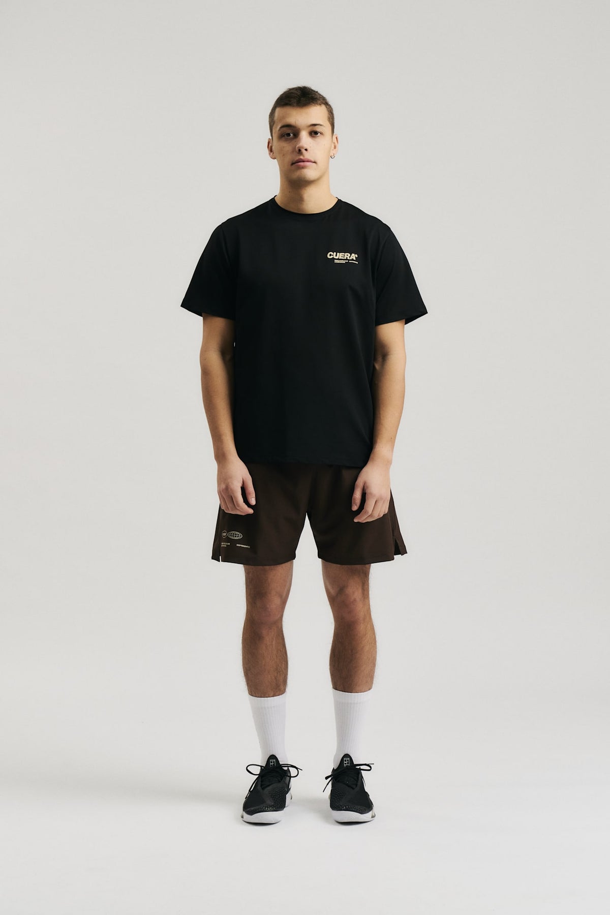 Model wearing Cuera Oncourt Breathe Cuera T-Shirt in Black, front studio view