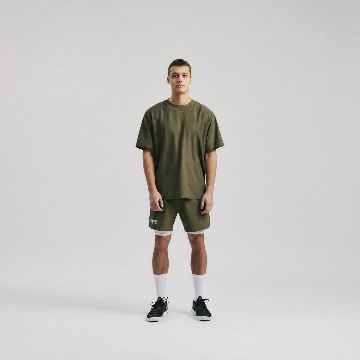 Model wearing Cuera Oncourt Breathe T-Shirt in Army, front studio view