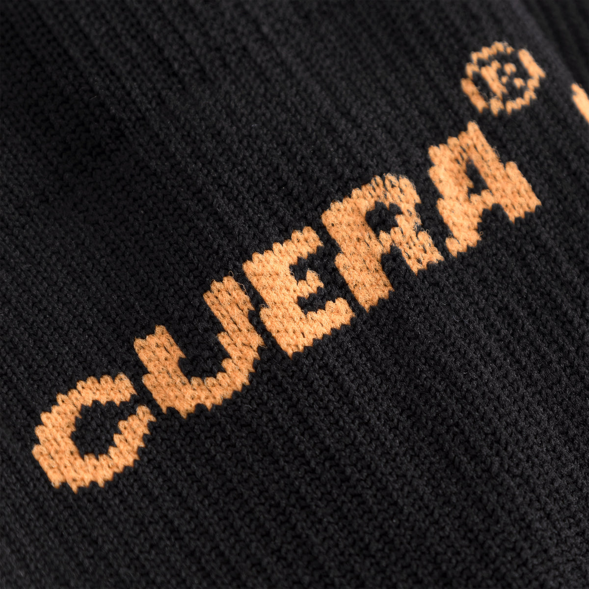 Cuera Oncourt Compression Sleeve in Black, logo print detail