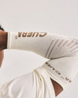 Model wearing Cuera Oncourt Compression Sleeve in Off White, close-up detail on model