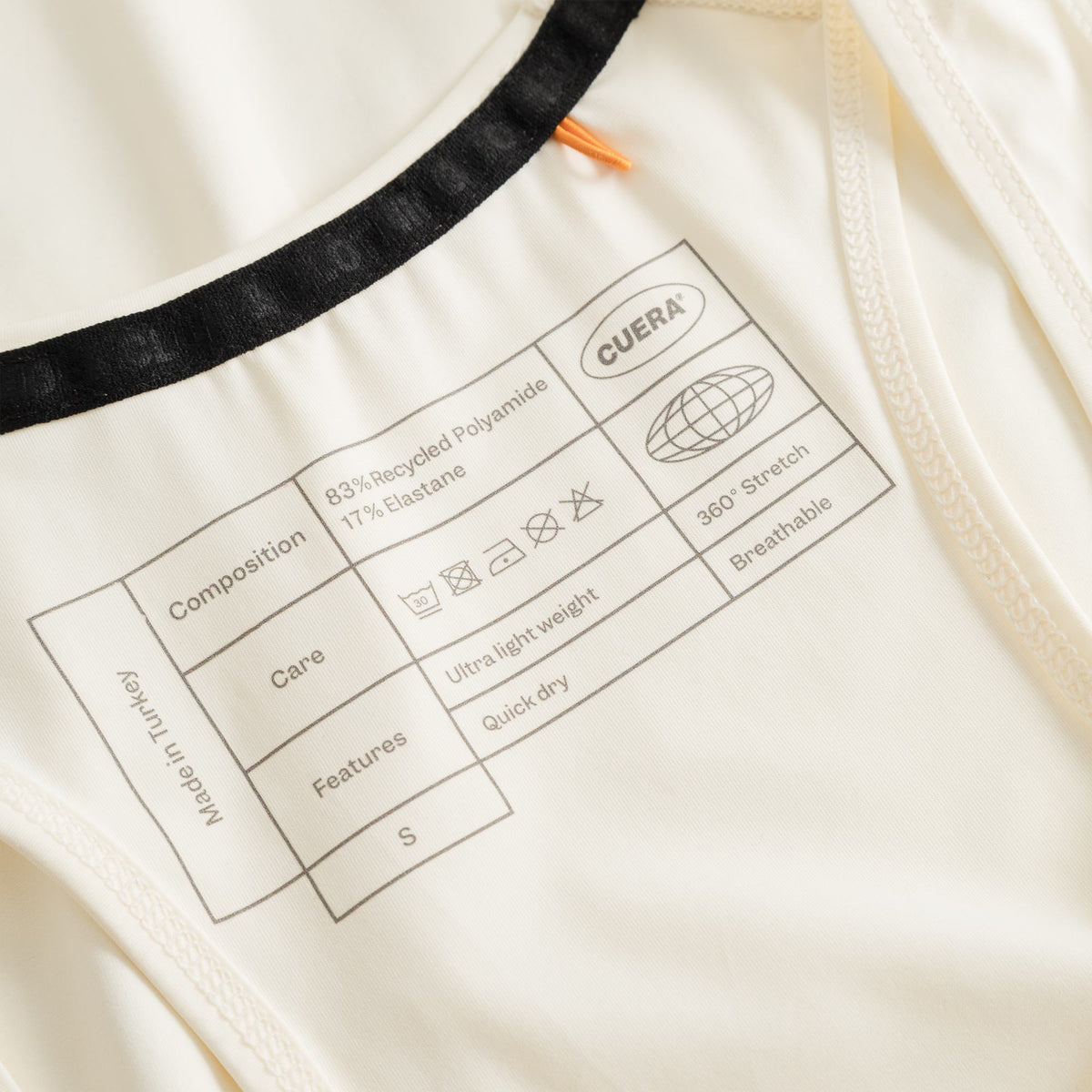 Cuera Oncourt Cuera Airy Tank Top in Off White, neck label and care tag detail