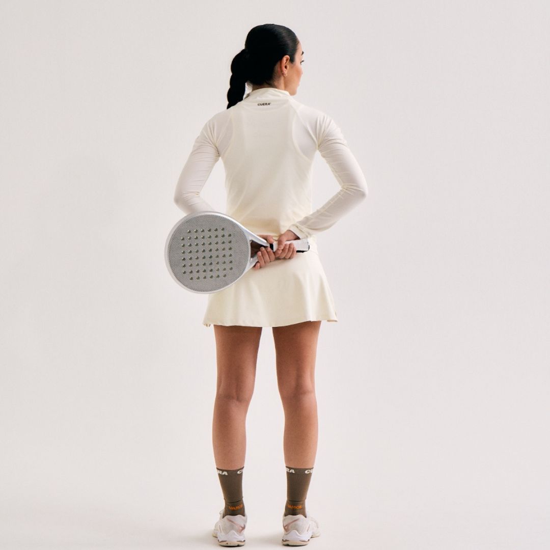 Model wearing Cuera Oncourt Cuera Skirt 2-in-1 in Off White, front studio view