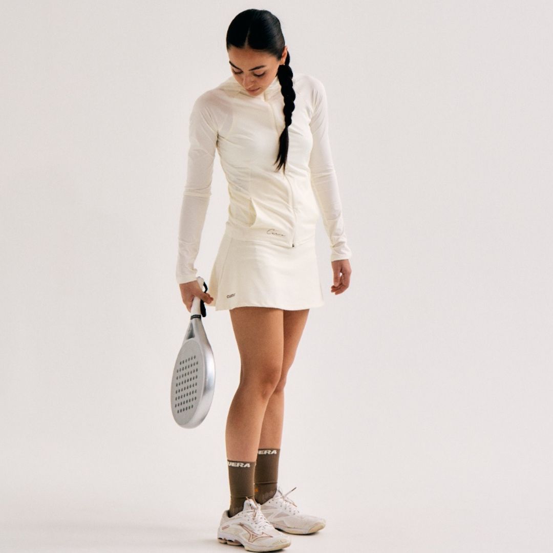 Model wearing Cuera Oncourt Cuera Skirt 2-in-1 in Off White, front studio view