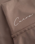 Cuera Oncourt Cuera Skirt 2-in-1 in Walnut, logo print detail