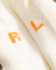 Cuera Oncourt Grip Sock in Off White, neck label and care tag detail