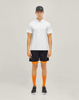 Model wearing Cuera Oncourt Made Polo ss in White, front studio view