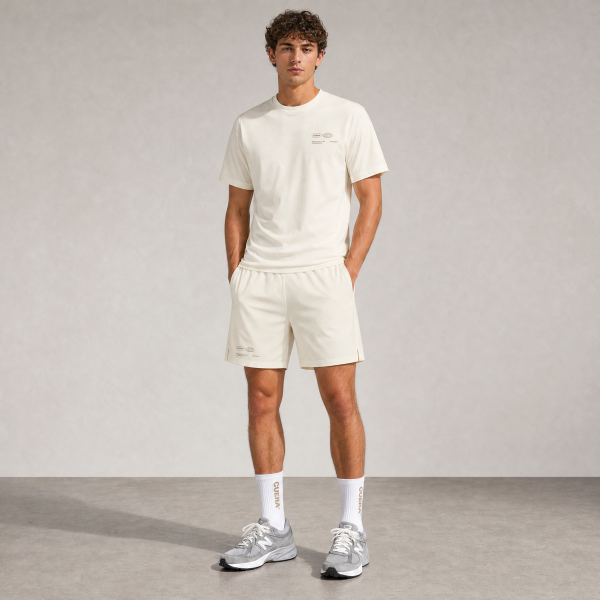 Model wearing Cuera Oncourt Off White Uniform, front studio view