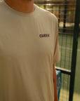 Model wearing Cuera Oncourt Sand Uniform, close-up detail on model
